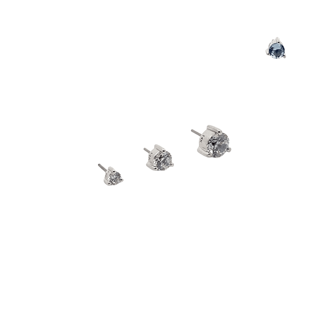 aquamarine birthstone stud earrings on a black background