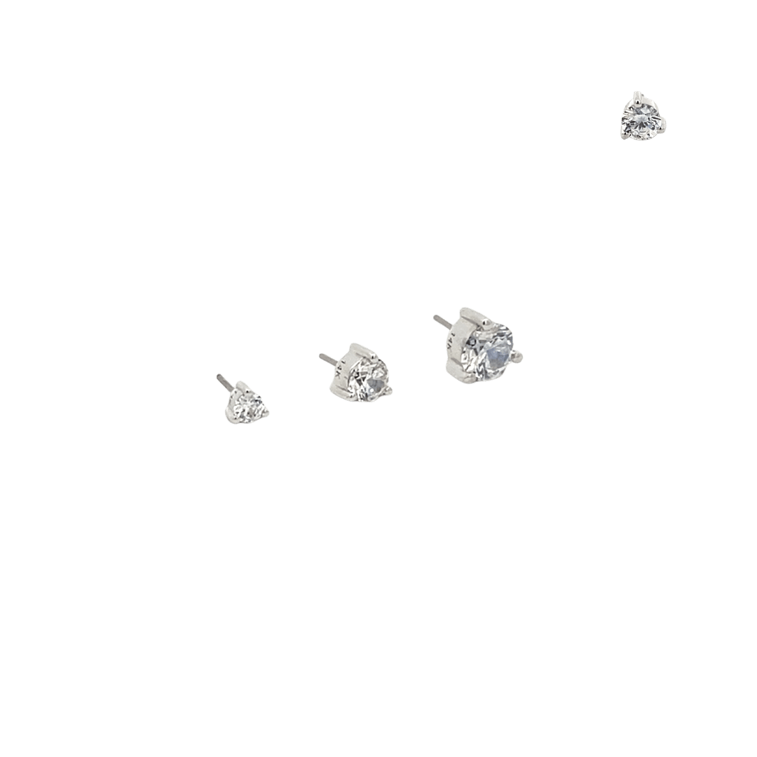 Set of diamond stud earrings on a black background