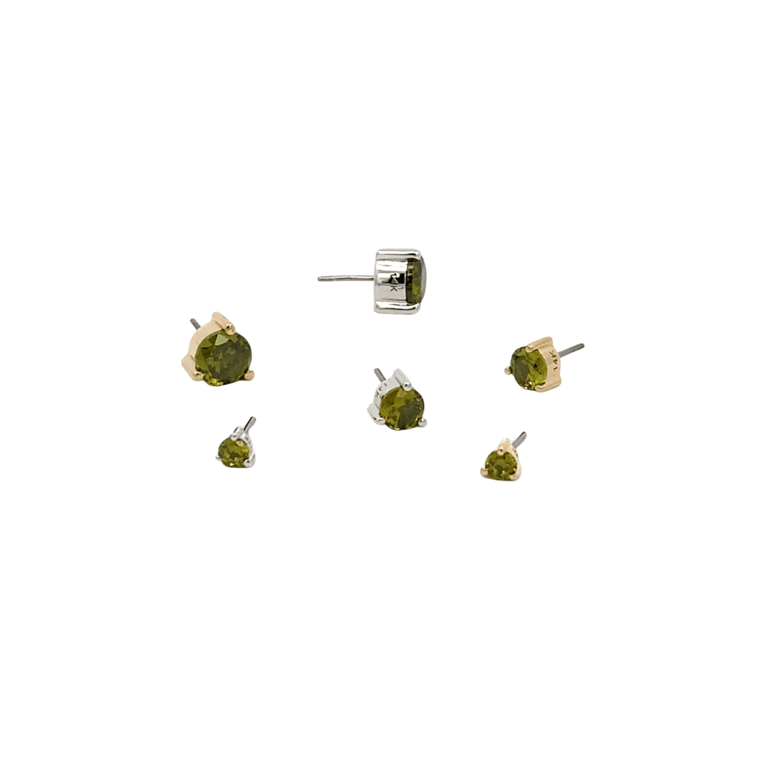 Set of peridot gemstone stud earrings on a black background