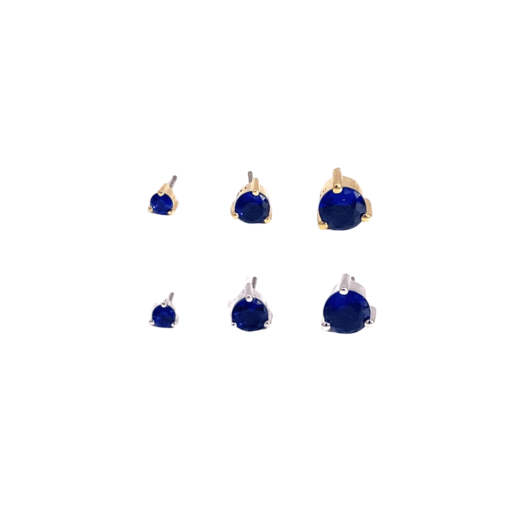 Set of blue gemstone earrings on a black background