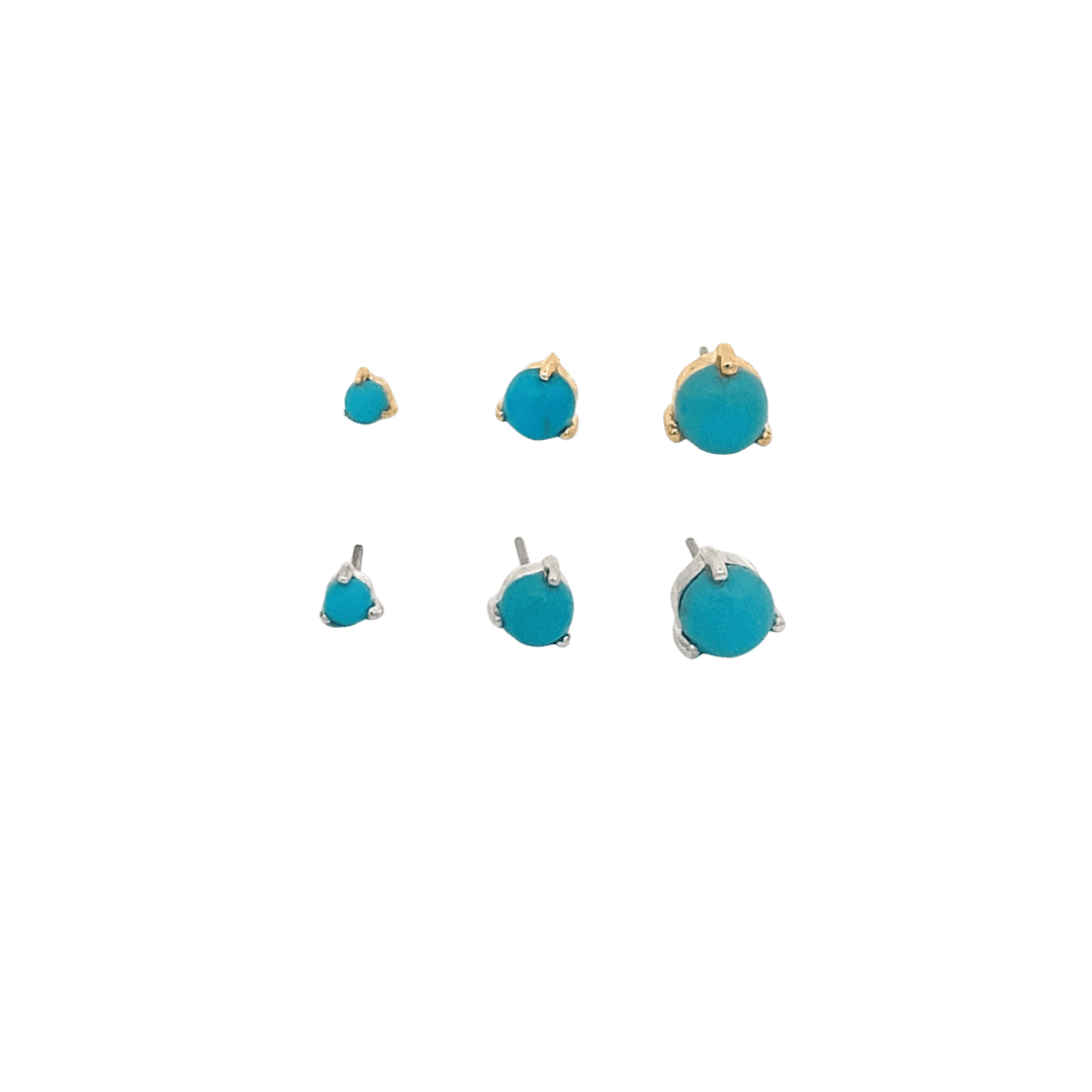 Set of turquoise earrings on a black background