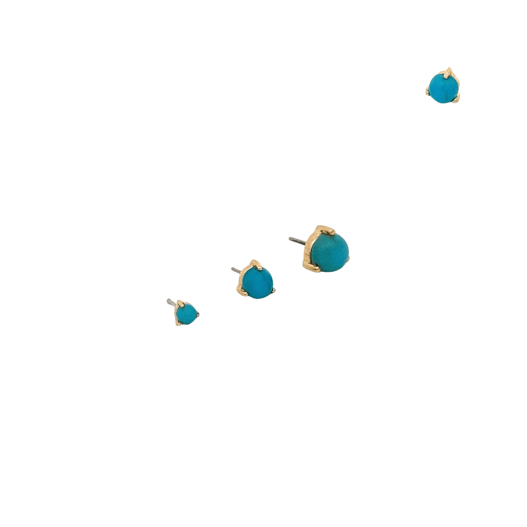 Set of turquoise stud earrings on a black background