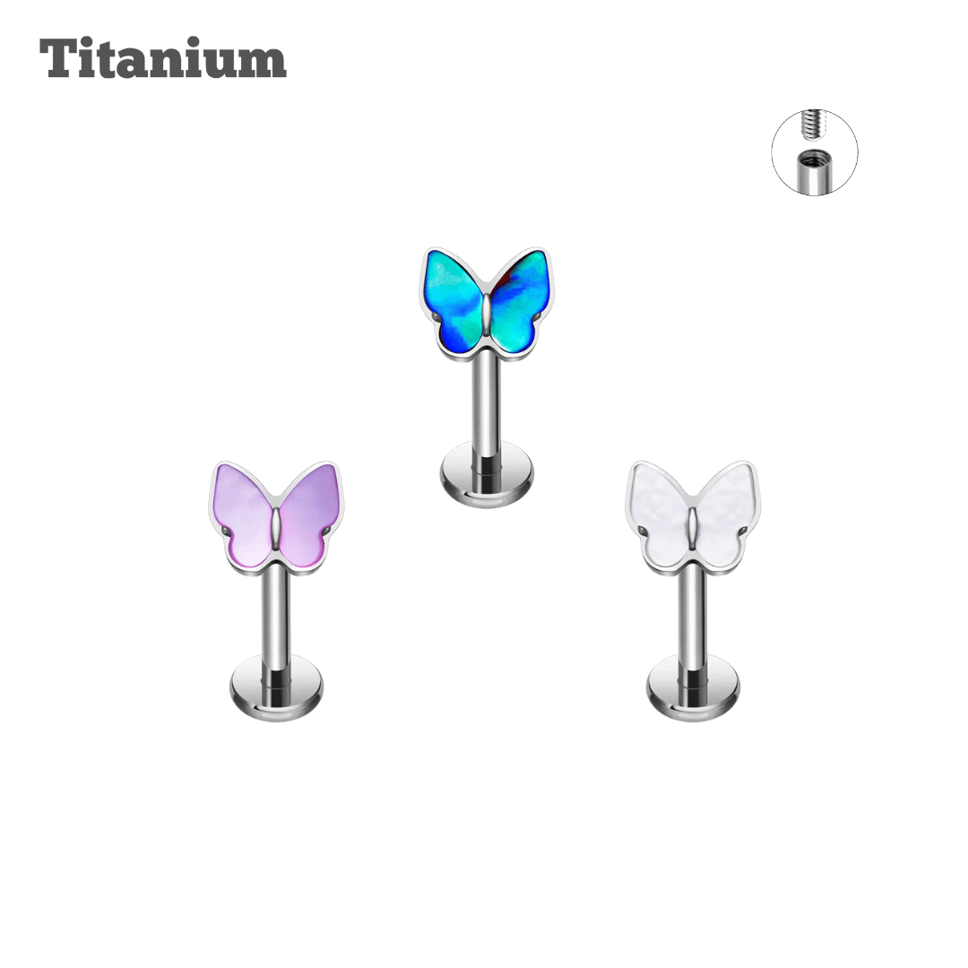 Butterfly-shaped jewelry pieces on a black background with 'Titanium' text.